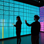 Immersive Art Installation**

"A modern art gallery featuring an interactive light installation. Visitors, fully clothed in contemporary fashion, are engaging with projections mapping onto the walls. The scene emphasizes vibrant colors and technological integration. Safe for work, appropriate content, fully clothed, professional, perfect anatomy, well-formed hands, digital art, high quality."

**